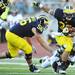 Michigan running back Thomas Rawls attempts to escape a UMass tackle during the third quarter at Michigan Stadium on Saturday. Melanie Maxwell I AnnArbor.com